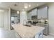 Modern kitchen with stainless steel appliances, granite countertops and a center island at 8126 Muddy Pines Pl, Tampa, FL 33635