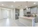 Bright, open kitchen with stainless steel appliances and granite countertops offer ample space at 8126 Muddy Pines Pl, Tampa, FL 33635