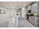 Modern kitchen with stainless steel appliances, granite countertops, open to entry at 8126 Muddy Pines Pl, Tampa, FL 33635
