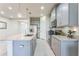Modern kitchen with stainless steel appliances, granite countertops and a large center island at 8126 Muddy Pines Pl, Tampa, FL 33635