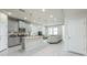 Modern kitchen with stainless steel appliances, granite countertops, open to living room at 8126 Muddy Pines Pl, Tampa, FL 33635