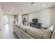 Spacious open-concept layout with seamless flow between the living room and modern kitchen at 8126 Muddy Pines Pl, Tampa, FL 33635