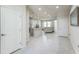 Open floor plan showcasing the kitchen and living area creating an inviting gathering space at 8126 Muddy Pines Pl, Tampa, FL 33635