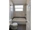 Bright bathroom with a tub and shower combination and tiled accents at 1834 28Th N Ave, St Petersburg, FL 33713