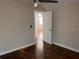 This bedroom has hardwood floors, a ceiling fan, and a closet at 1834 28Th N Ave, St Petersburg, FL 33713