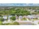 Street view of the houses and some trees surrounding the property, and a lake nearby at 22802 Roderick Dr, Land O Lakes, FL 34639