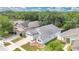 Aerial view of the property showcases lush landscaping, mature trees, and proximity to nearby waterways at 22802 Roderick Dr, Land O Lakes, FL 34639
