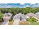 Aerial shot of a well-maintained single Gathering home with lush landscaping and mature shade trees at 22802 Roderick Dr, Land O Lakes, FL 34639
