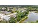 Aerial shot of the neighborhood and the lake surrounding with trees at 22802 Roderick Dr, Land O Lakes, FL 34639