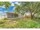 This home includes a spacious backyard with a screened-in porch, perfect for outdoor gatherings and relaxation at 22802 Roderick Dr, Land O Lakes, FL 34639