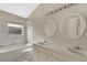 Bathroom includes a tub and shower combo and a dual sink vanity at 22802 Roderick Dr, Land O Lakes, FL 34639