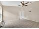 This neutral bedroom offers tile floors, ceiling fan, and lots of natural light at 22802 Roderick Dr, Land O Lakes, FL 34639