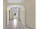 Bright entryway with tiled floors, high ceilings, and views to the front door and the front yard at 22802 Roderick Dr, Land O Lakes, FL 34639