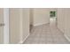 Hallway showcasing neutral walls, and tiled flooring leading to other rooms at 22802 Roderick Dr, Land O Lakes, FL 34639