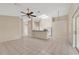 Spacious living area with tiled floors, a breakfast bar, and ample natural light at 22802 Roderick Dr, Land O Lakes, FL 34639