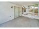 This screened patio features sliding glass doors and offers an ideal space for relaxation or outdoor dining at 22802 Roderick Dr, Land O Lakes, FL 34639
