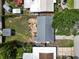 Aerial view of a single-Gathering home with a well-maintained yard and landscaping at 9033 3Rd N St, St Petersburg, FL 33702