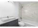 Updated bathroom featuring a modern vanity and marble tile shower at 9033 3Rd N St, St Petersburg, FL 33702