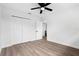 Bedroom with hardwood style flooring and spacious closet at 9033 3Rd N St, St Petersburg, FL 33702