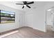 Clean bedroom offers a window with natural light and a light-colored floor at 9033 3Rd N St, St Petersburg, FL 33702