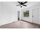 Bright bedroom featuring a ceiling fan, a window, and neutral paint, creating a calming and inviting space at 9033 3Rd N St, St Petersburg, FL 33702