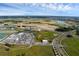 Expansive aerial view showcasing the development, surrounding community, and landscape on a sunny day at 10815 Laxer Cay Loop, San Antonio, FL 33576