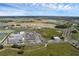 Expansive aerial view showcasing the development, surrounding community, and landscape on a sunny day at 10815 Laxer Cay Loop, San Antonio, FL 33576
