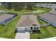 Wide aerial perspective of the property highlighting the backyard and its desirable location within the community at 10815 Laxer Cay Loop, San Antonio, FL 33576