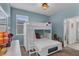 Charming bedroom with blue walls and a cozy bunk bed at 10815 Laxer Cay Loop, San Antonio, FL 33576