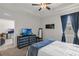 Bedroom featuring neutral decor, carpet, and a window with curtains, allowing lots of natural light at 10815 Laxer Cay Loop, San Antonio, FL 33576