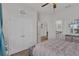 Bedroom with a view to the Primary bath and walk in closet at 10815 Laxer Cay Loop, San Antonio, FL 33576