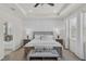Well-lit bedroom boasts an en suite bathroom, tray ceilings, and recessed lighting at 10815 Laxer Cay Loop, San Antonio, FL 33576