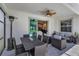 Covered patio with outdoor furniture, ceiling fan, and views into the interior at 10815 Laxer Cay Loop, San Antonio, FL 33576