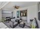 Covered patio with plenty of seating and views into the living room at 10815 Laxer Cay Loop, San Antonio, FL 33576
