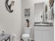 Nautical themed powder room with granite countertop and decorative accents at 10815 Laxer Cay Loop, San Antonio, FL 33576