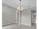 Open concept dining room with high ceilings, tile flooring and decorative lighting at 3137 Marine Grass Dr, Wimauma, FL 33598