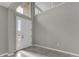 Light filled foyer with tile flooring and soaring ceilings leading to a bright, airy interior at 3137 Marine Grass Dr, Wimauma, FL 33598