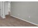 Hallway with neutral walls, carpet, white trim, and access to other rooms at 3137 Marine Grass Dr, Wimauma, FL 33598