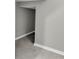 Hallway featuring neutral paint, ceramic tile, and a doorway to another room at 3137 Marine Grass Dr, Wimauma, FL 33598