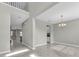 Bright, open-concept living room with a large, tiled floor at 3137 Marine Grass Dr, Wimauma, FL 33598
