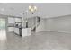 Open concept living space featuring kitchen with island and stainless steel appliances at 3137 Marine Grass Dr, Wimauma, FL 33598