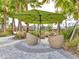 Charming outdoor seating area with umbrella, perfect for enjoying the outdoors at 3137 Marine Grass Dr, Wimauma, FL 33598