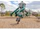 Fun-filled community playground with slides and climbing structures, perfect for entertainment at 3137 Marine Grass Dr, Wimauma, FL 33598