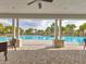 Stunning community pool surrounded by palm trees, perfect for relaxing and enjoying the Florida lifestyle at 3137 Marine Grass Dr, Wimauma, FL 33598