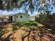 Spacious backyard with a tree swing, perfect for outdoor enjoyment and relaxation at 1079 Woodbrook S Dr, Largo, FL 33770