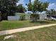 Inviting single-Gathering home with a charming front yard, mature tree, and attached garage at 1079 Woodbrook S Dr, Largo, FL 33770