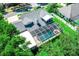 Aerial view of a backyard featuring a screened-in pool area, perfect for outdoor entertaining at 3009 Ridgevale Cir, Valrico, FL 33596