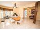 Spacious dining room with tile floors, large windows, and natural light, perfect for entertaining at 3009 Ridgevale Cir, Valrico, FL 33596