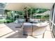 Large, covered patio with outdoor seating and a fully equipped outdoor kitchen at 3009 Ridgevale Cir, Valrico, FL 33596