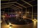 Inviting screened in pool area with ambient lighting at 3009 Ridgevale Cir, Valrico, FL 33596
